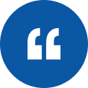 White quotation mark symbol inside a blue circle on a white background.